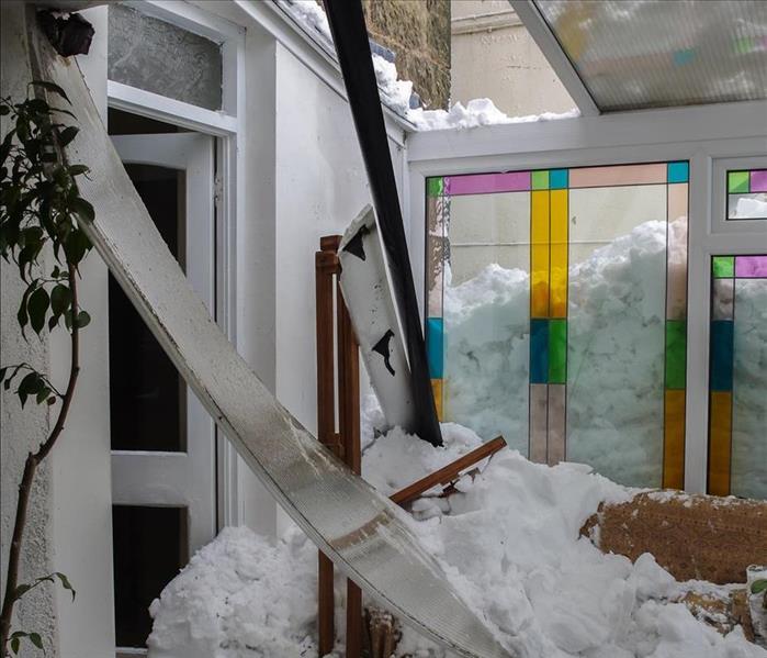 snow damage, through windows in a house