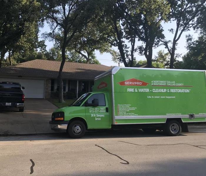 SERVPRO truck parked in front of a home.